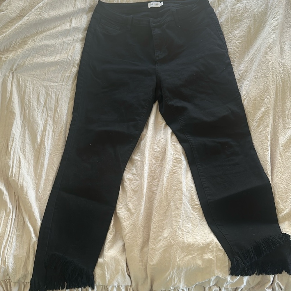Ms Cello frayed him black jeans